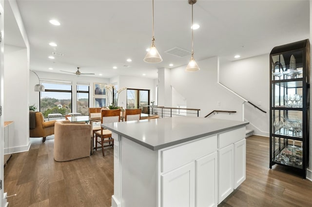2050 Lohmans Spur Rd Unit 101, Lakeway, TX 78734 - kitchen featuring ceiling fan, visible vents, a center island, wood finished floors, and recessed lighting