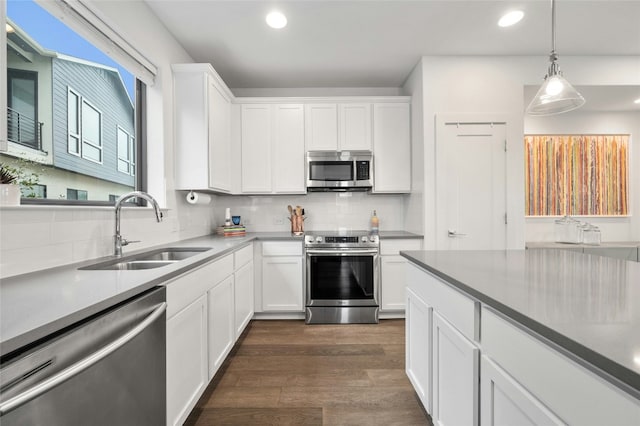 2050 Lohmans Spur Rd Unit 101, Lakeway, TX 78734 - kitchen with a sink, backsplash, dark wood-style floors, and stainless steel appliances