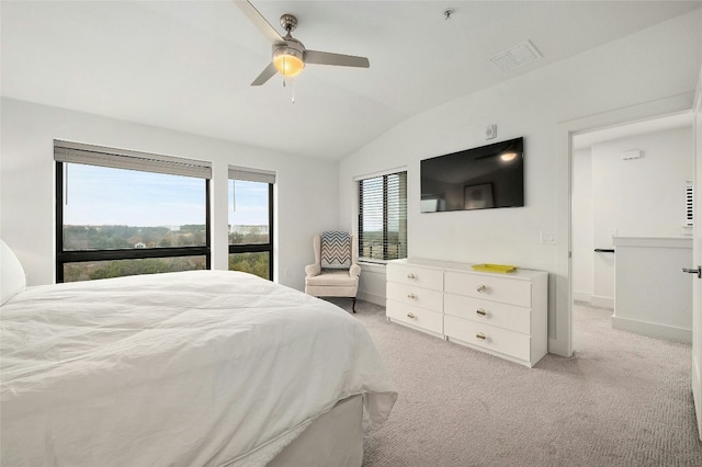 bedroom with light carpet, vaulted ceiling, and ceiling fan