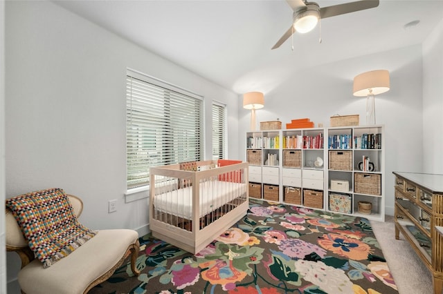 2050 Lohmans Spur Rd Unit 101, Lakeway, TX 78734 - carpeted bedroom with baseboards and a ceiling fan