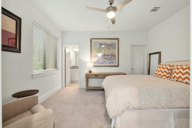 2050 Lohmans Spur Rd Unit 101, Lakeway, TX 78734 - bedroom with light colored carpet, baseboards, connected bathroom, and a ceiling fan