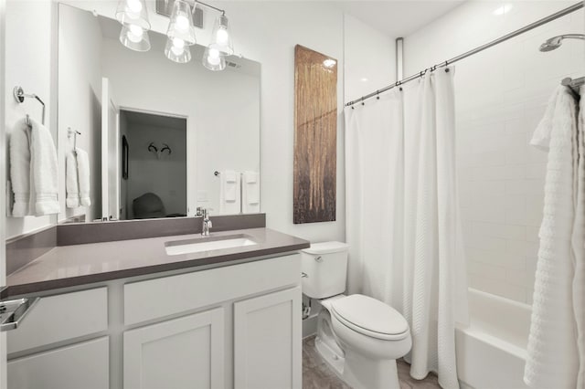 full bathroom featuring vanity, toilet, and shower / bath combo