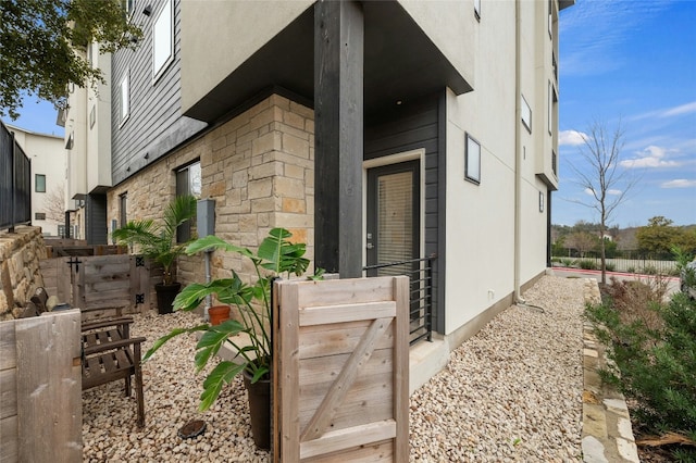 2050 Lohmans Spur Rd Unit 101, Lakeway, TX 78734 - view of exterior entry featuring stucco siding