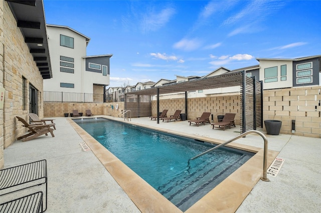 view of swimming pool featuring a patio area