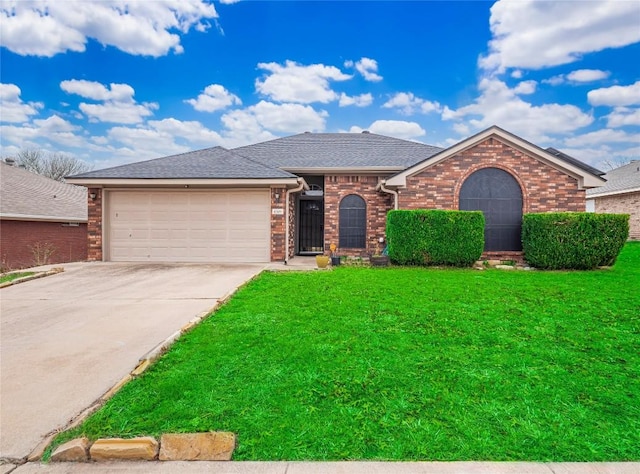 view of front of home with a garage and a front lawn