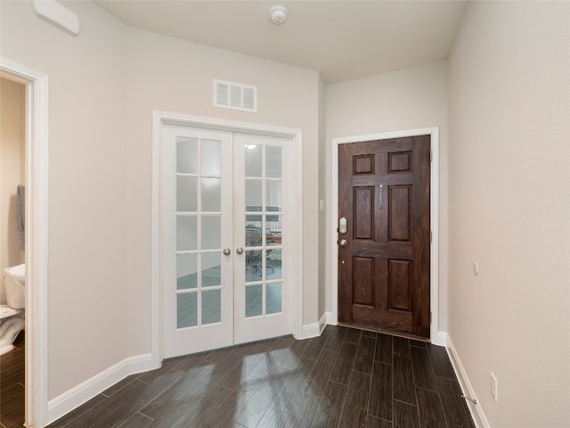 237 Andele Way, Liberty Hill, TX 78642 - foyer entrance with french doors, dark wood-style flooring, and baseboards