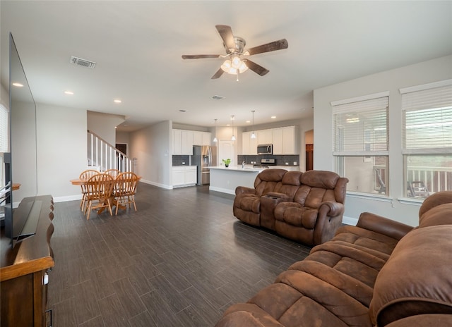 237 Andele Way, Liberty Hill, TX 78642 - living room featuring baseboards, ceiling fan, healthy amount of natural light, and recessed lighting