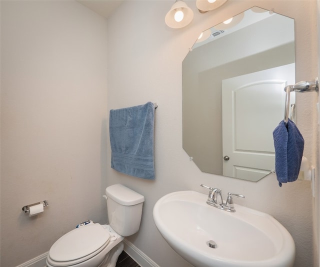237 Andele Way, Liberty Hill, TX 78642 - half bath featuring a sink, toilet, and baseboards