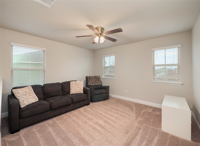 237 Andele Way, Liberty Hill, TX 78642 - carpeted living area featuring baseboards, healthy amount of natural light, and a ceiling fan