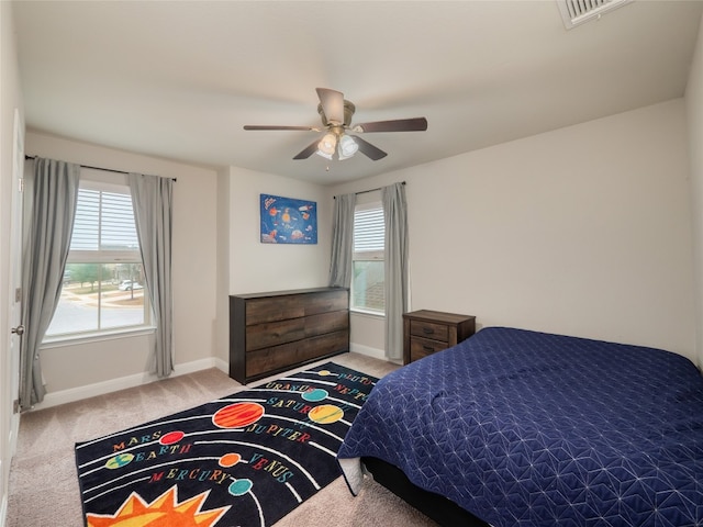 237 Andele Way, Liberty Hill, TX 78642 - bedroom featuring carpet floors, baseboards, multiple windows, and ceiling fan