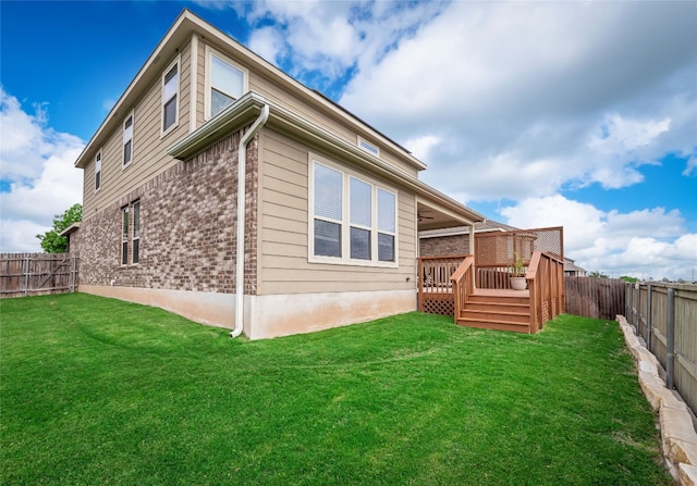 237 Andele Way, Liberty Hill, TX 78642 - rear view of house with a wooden deck and brick siding