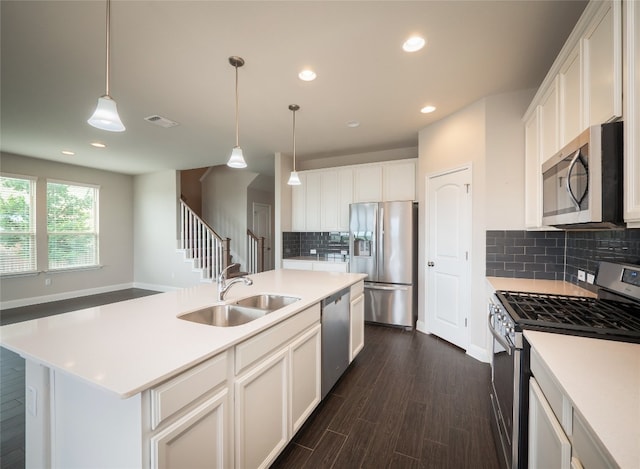 237 Andele Way, Liberty Hill, TX 78642 - kitchen with appliances with stainless steel finishes, recessed lighting, backsplash, and white cabinetry