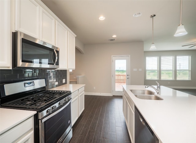 237 Andele Way, Liberty Hill, TX 78642 - kitchen featuring stainless steel appliances, dark wood-style floors, light countertops, white cabinets, and recessed lighting