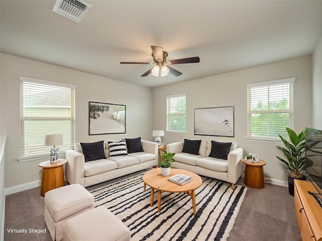 237 Andele Way, Liberty Hill, TX 78642 - carpeted living area featuring baseboards and a ceiling fan