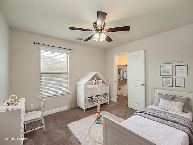 237 Andele Way, Liberty Hill, TX 78642 - carpeted bedroom featuring a spacious closet and a ceiling fan