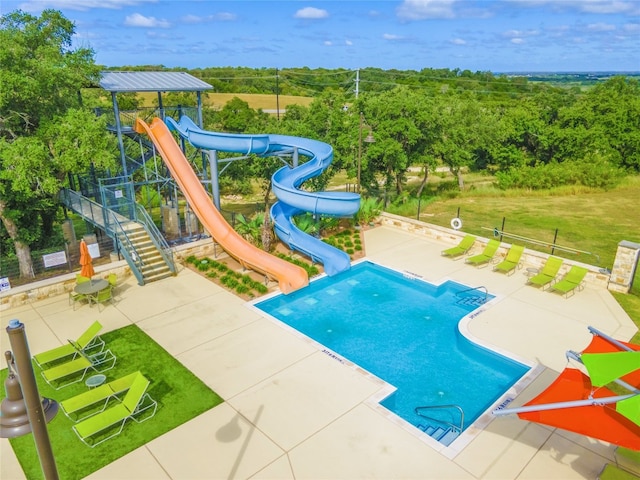 237 Andele Way, Liberty Hill, TX 78642 - community pool with a water slide, a patio, and a yard