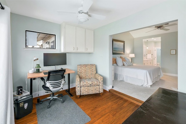 bedroom featuring ensuite bathroom, hardwood / wood-style floors, and ceiling fan