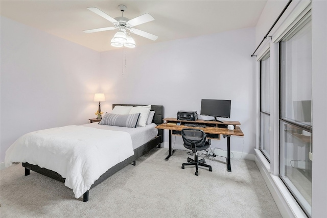 bedroom with light carpet and ceiling fan