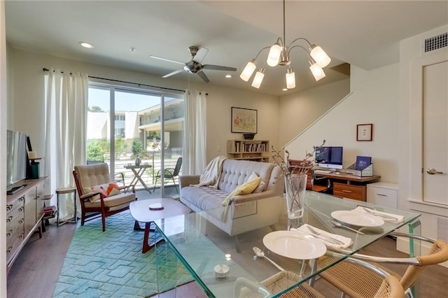 living room with ceiling fan and wood-type flooring