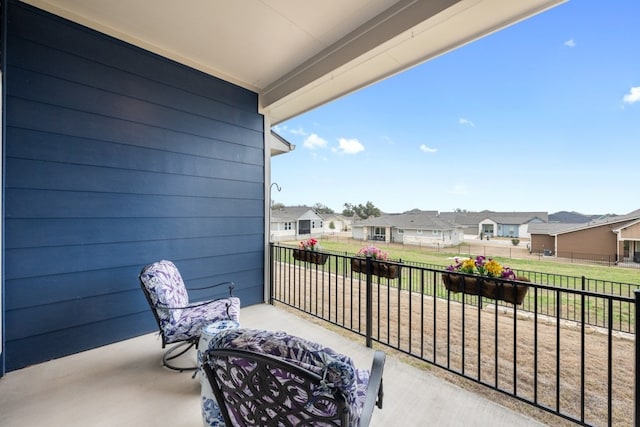 balcony featuring a residential view