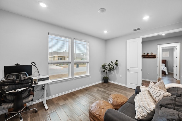 home office featuring recessed lighting, visible vents, baseboards, and wood finished floors