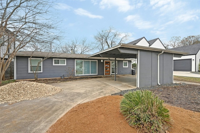 single story home featuring a carport