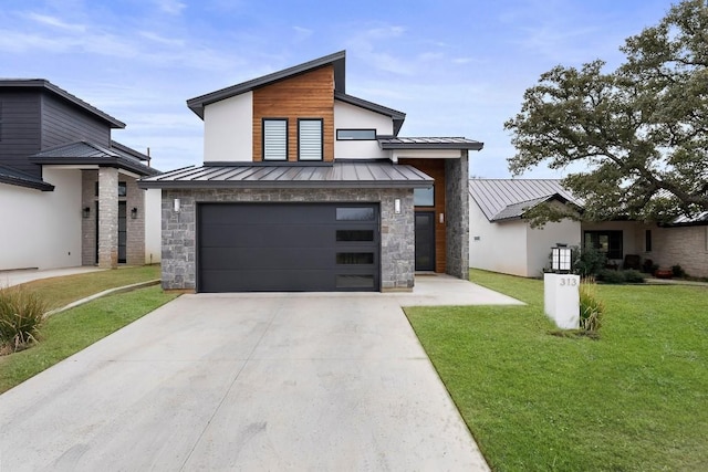 view of front of house featuring a garage and a front yard