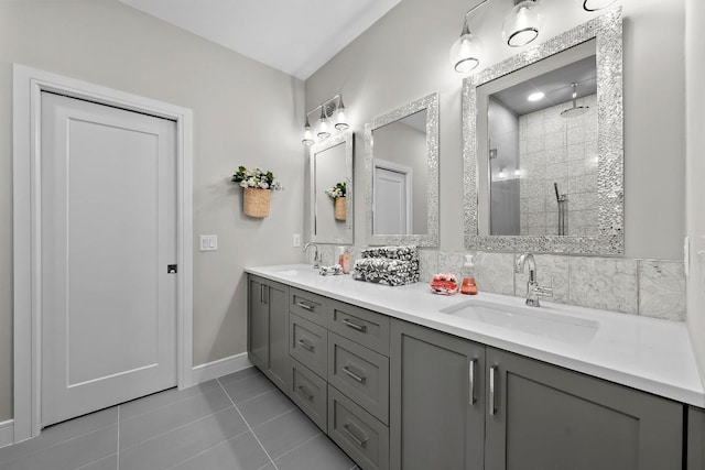 bathroom with vanity, walk in shower, tile patterned floors, and decorative backsplash