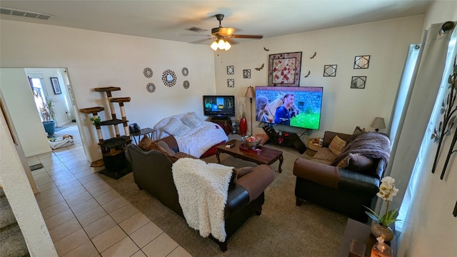 living room featuring light tile patterned floors and ceiling fan