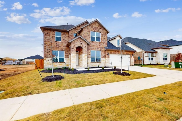 view of front of house with a garage and a front yard