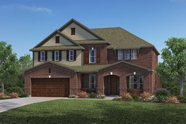 view of front facade with a garage and a front yard