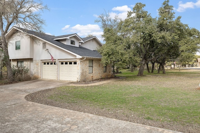 view of home's exterior with a garage and a yard