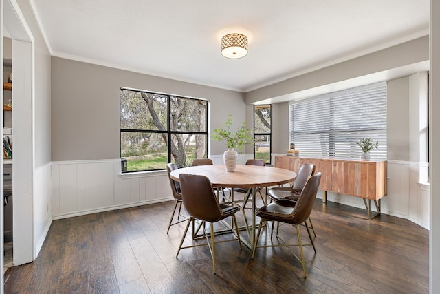 dining area featuring crown molding and dark hardwood / wood-style floors