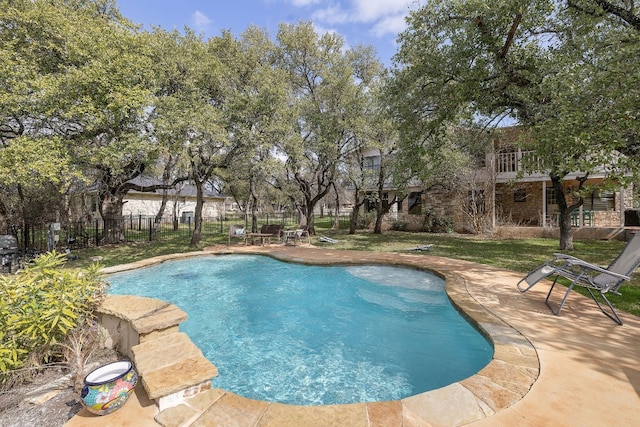 view of swimming pool with a patio