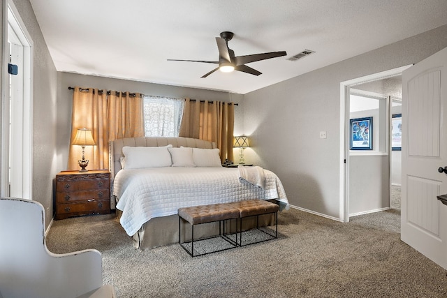 bedroom with ceiling fan and carpet flooring