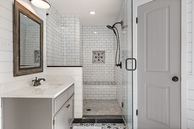 bathroom with vanity and walk in shower