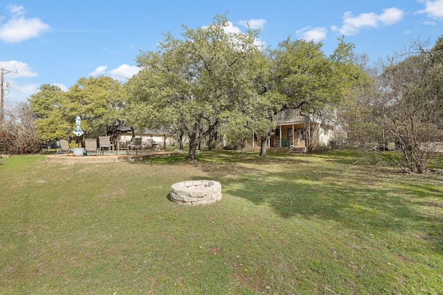 view of yard featuring a patio and a fire pit