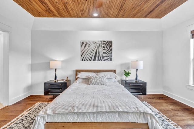 bedroom with hardwood / wood-style floors and wooden ceiling