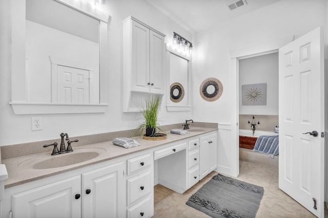 bathroom with vanity and tile patterned flooring