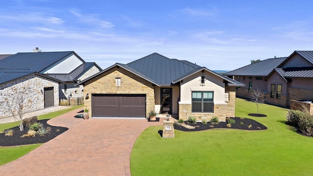 view of front of house with a garage and a front yard