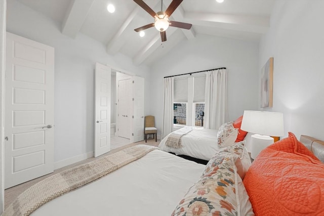 carpeted bedroom featuring ceiling fan and vaulted ceiling with beams