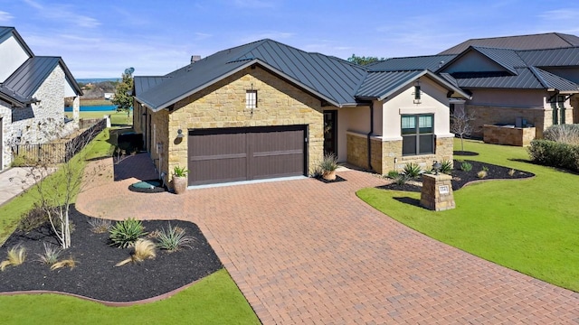 view of front of home featuring a garage and a front yard