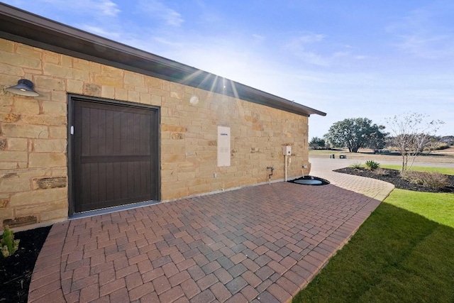 view of side of property featuring a patio area