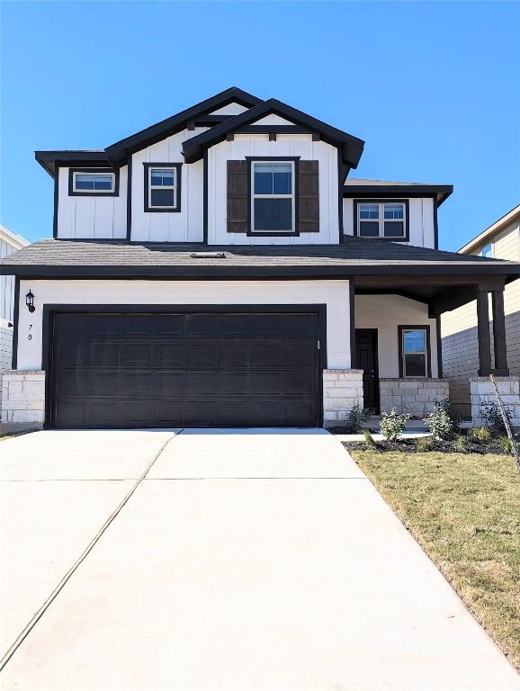 view of front facade featuring a garage and a front lawn