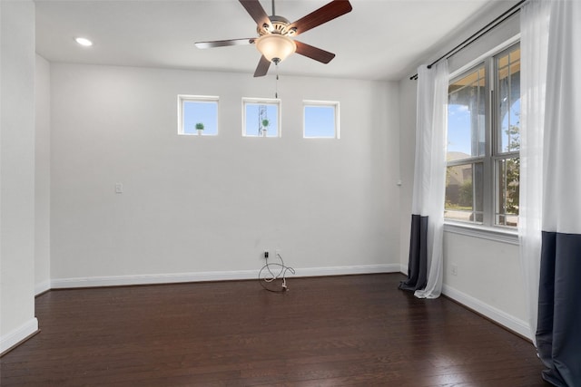 unfurnished room with ceiling fan and dark hardwood / wood-style floors