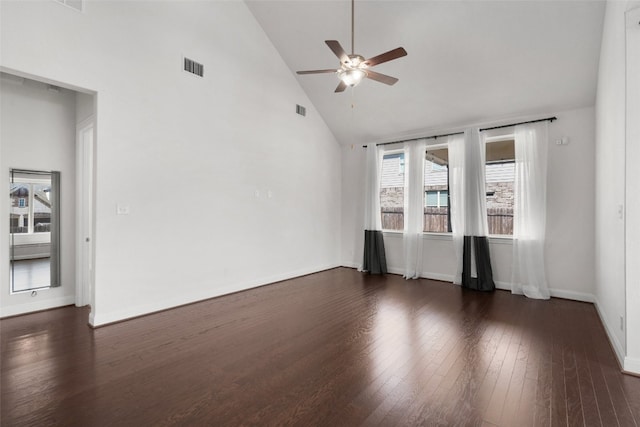 spare room with high vaulted ceiling, dark hardwood / wood-style floors, and ceiling fan