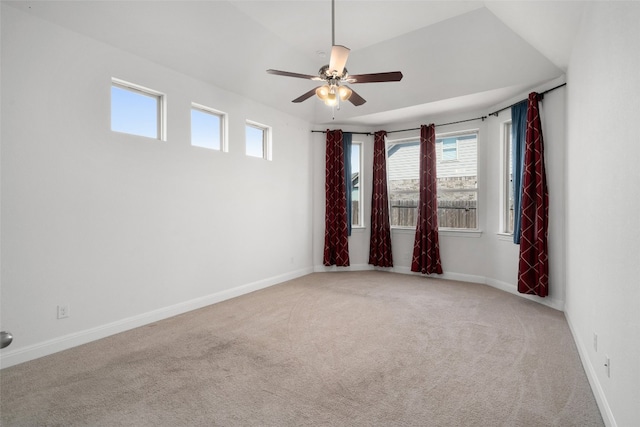 spare room featuring light colored carpet and ceiling fan