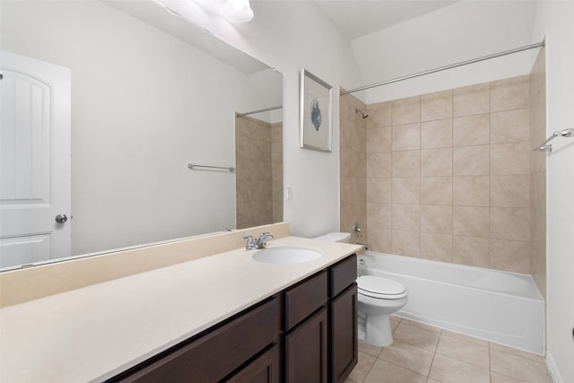 full bathroom featuring tile patterned floors, toilet, tiled shower / bath combo, and vanity