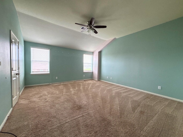 2709 Calypso Pl, Texas City, TX 77568 - empty room featuring carpet floors, a ceiling fan, vaulted ceiling, and baseboards
