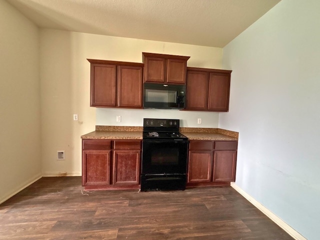 2709 Calypso Pl, Texas City, TX 77568 - kitchen with black appliances, dark wood finished floors, and baseboards